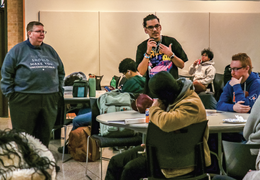 NE student Jack Buch talks to the audience during the Rise of Fascism event. He addresses the similarities between the the rise of fascism in Germany and Italy during World War I and today.